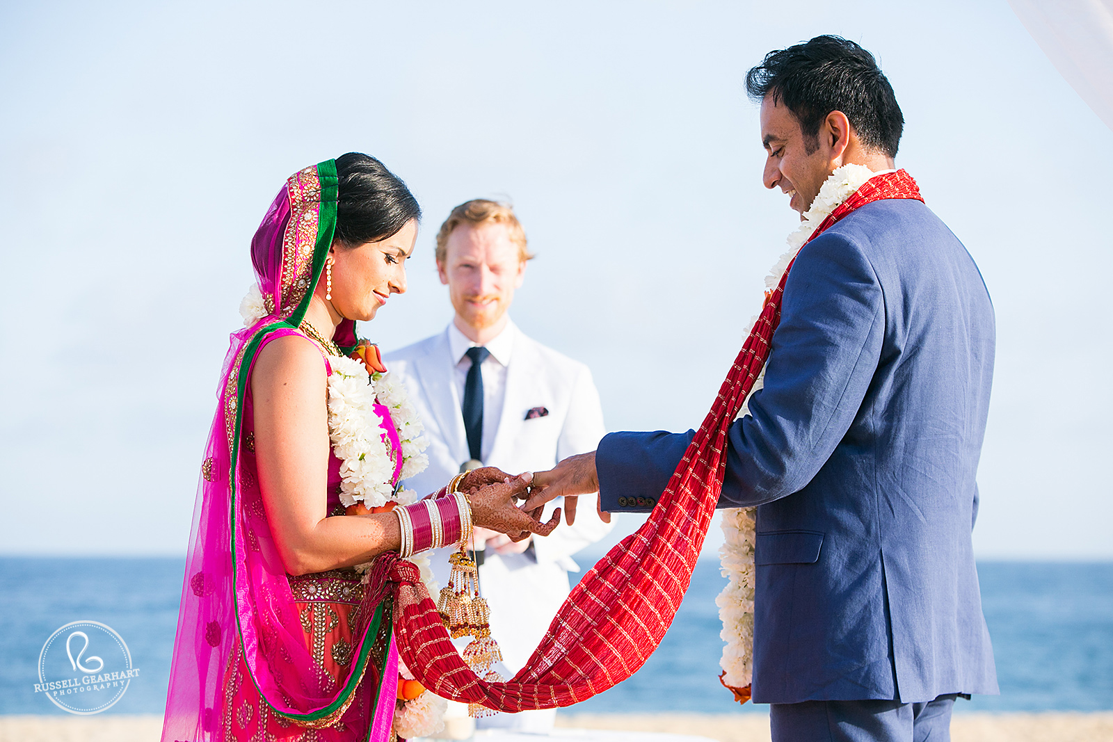 Exchanging Rings – Pueblo Bonito Sunset Beach Wedding – Russell Gearhart Photography – www.gearhartphoto.com
