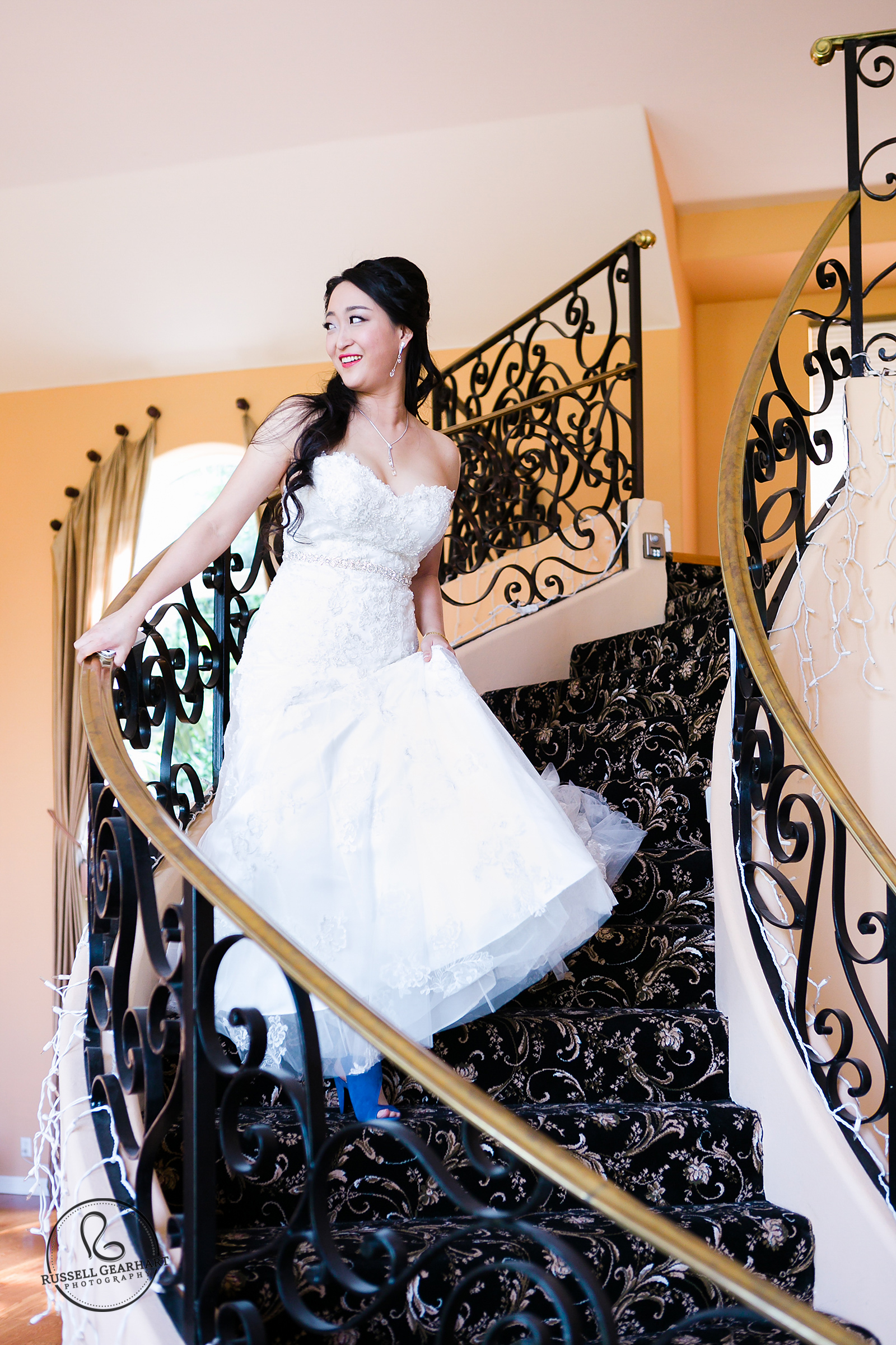 Stunning bride descends staircase in La Canada home – La Canada Flintridge Wedding – Russell Gearhart Photography – www.gearhartphoto.com