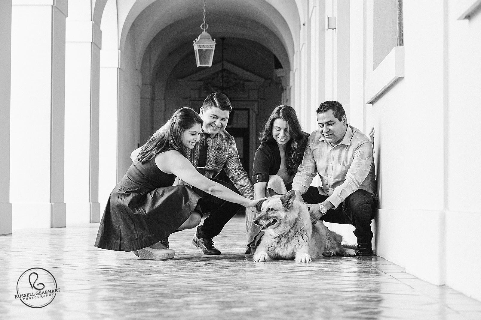 Family petting dog - Pasadena City Hall Family Portrait Session – Russell Gearhart Photography – www.gearhartphoto.com