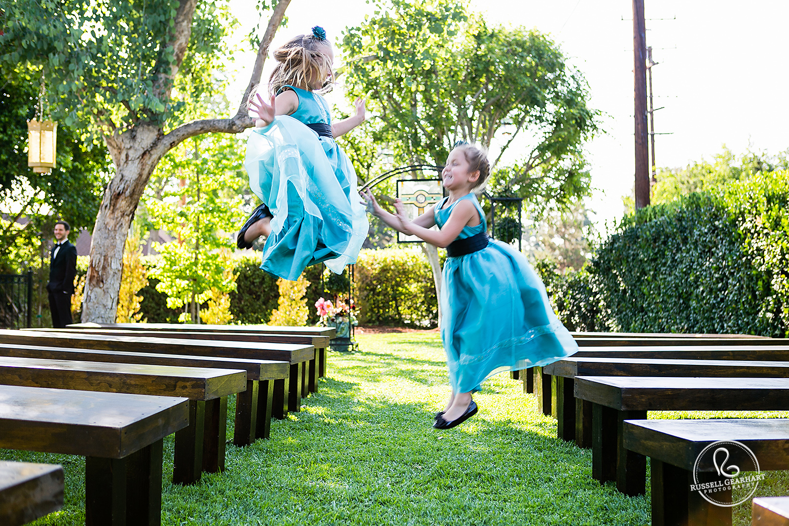 Flower Girls Jumping in Aisle - Orange County Backyard Wedding – Russell Gearhart Photography – www.gearhartphoto.com